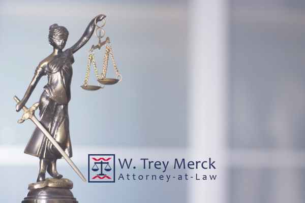 an image of the statue of justice on an attorney's desk