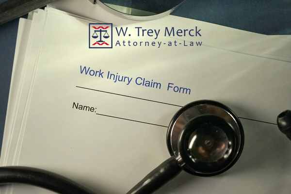 a work injury claim form on a desk